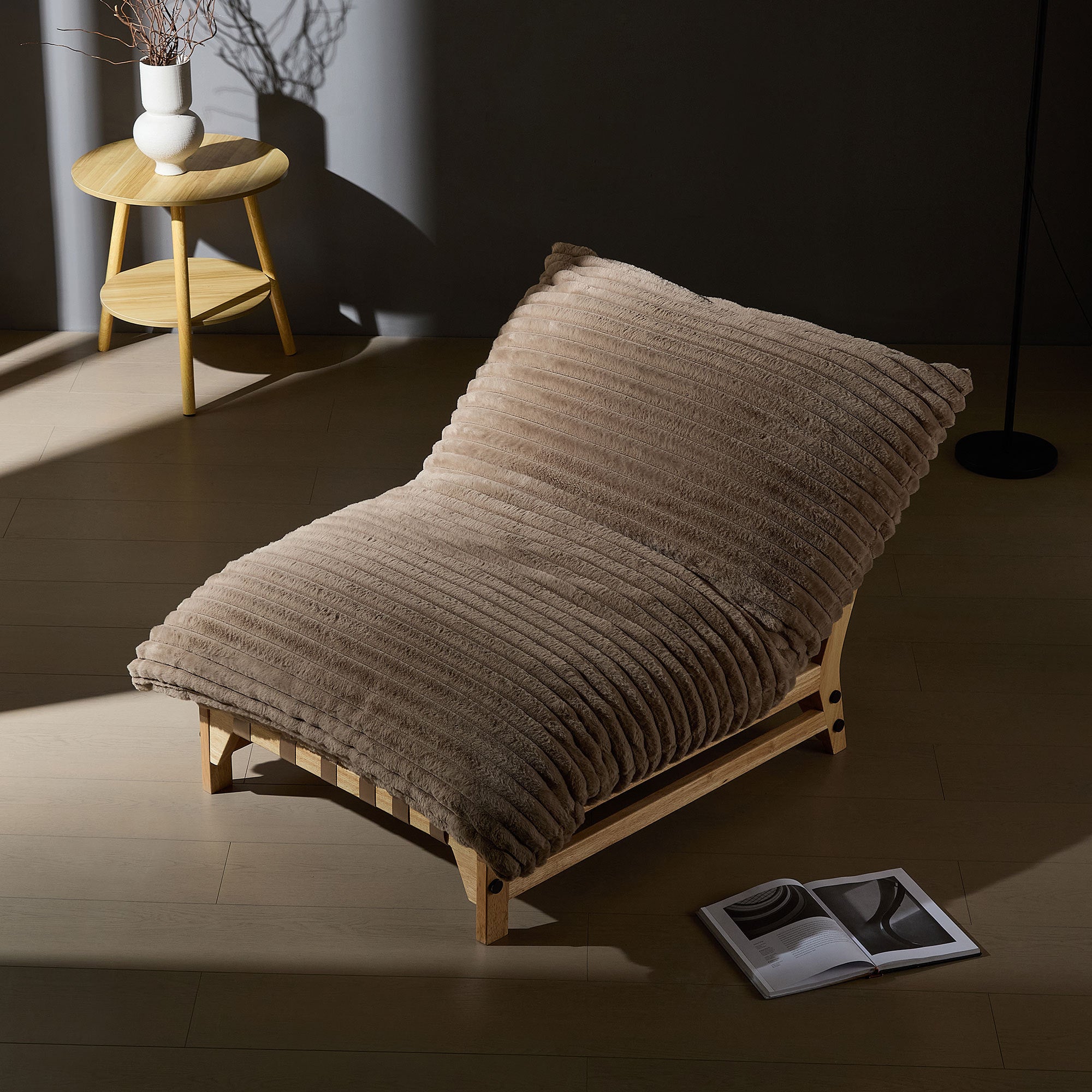 Corduroy sofa chair in a dimly lit room, showcasing its cozy design and inviting texture for nighttime relaxation.