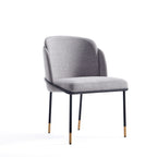 Modern Dining Chair - Stylish Grey - Durable Metal Base with curved backrest, black legs, and gold tips, ideal for dining or office use.