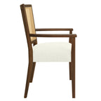 Side profile of Mid-Century Rattan Dining Chair with ergonomic armrests and thick cushioned seat supported by a solid wood frame.