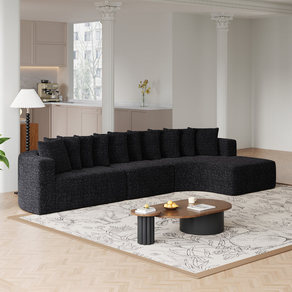 Chenille Sectional Sofa - Modular L-Shaped Sofa in black with 10 pillows, arranged in a spacious living room with floral rug and wood flooring.