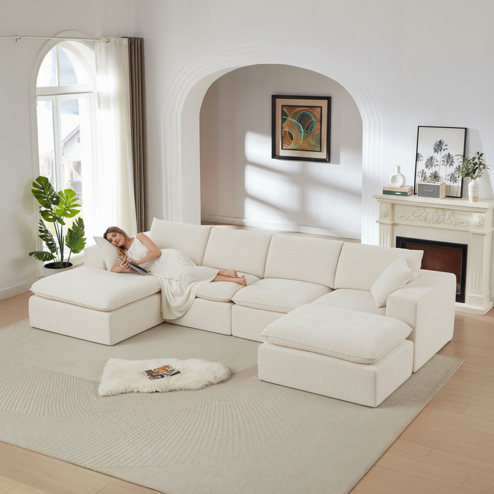 Cream-colored modular chenille sectional sofa with a deep, plush cloud-like design in a bright, modern living room.