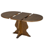 Farmhouse dining table partially extended with center leaf visible. Offers flexible seating for gatherings.