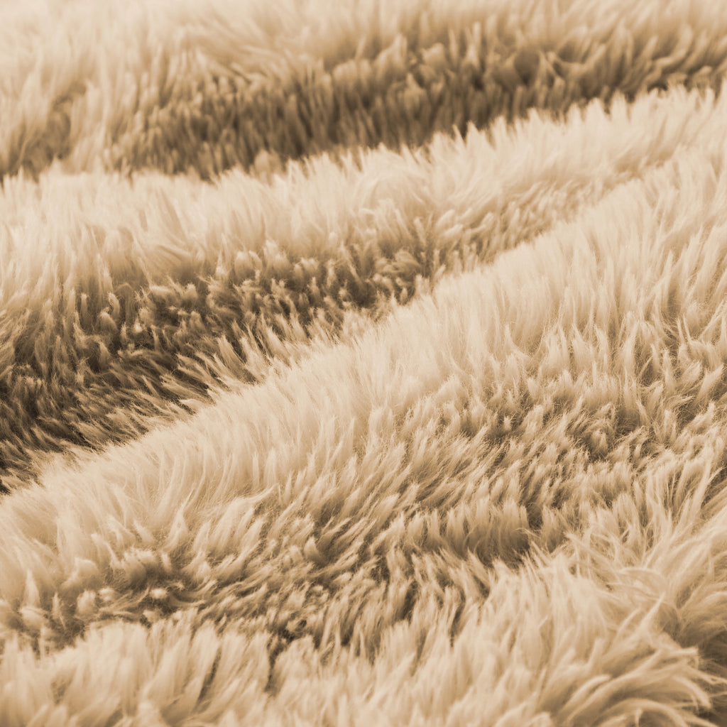 Close-up of ultra-soft plush fabric used in the light khaki modular sofa, emphasizing comfort and luxurious texture.