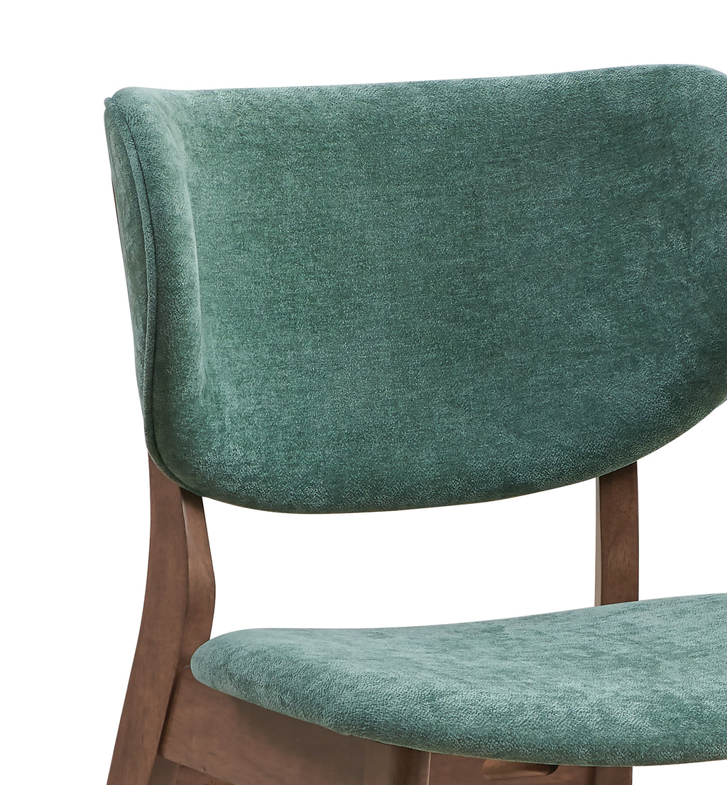 Close-up of padded green backrest on walnut dining chair, highlighting comfort and style in the 5-piece walnut dining set.