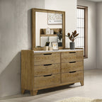 Brown dresser with 6 drawers paired with matching mirror, styled in a transitional bedroom setup with decorative accents.