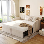 Beige upholstered twin daybed with a pop-up trundle, nailhead trim, and integrated USB ports in a cozy bedroom setting.