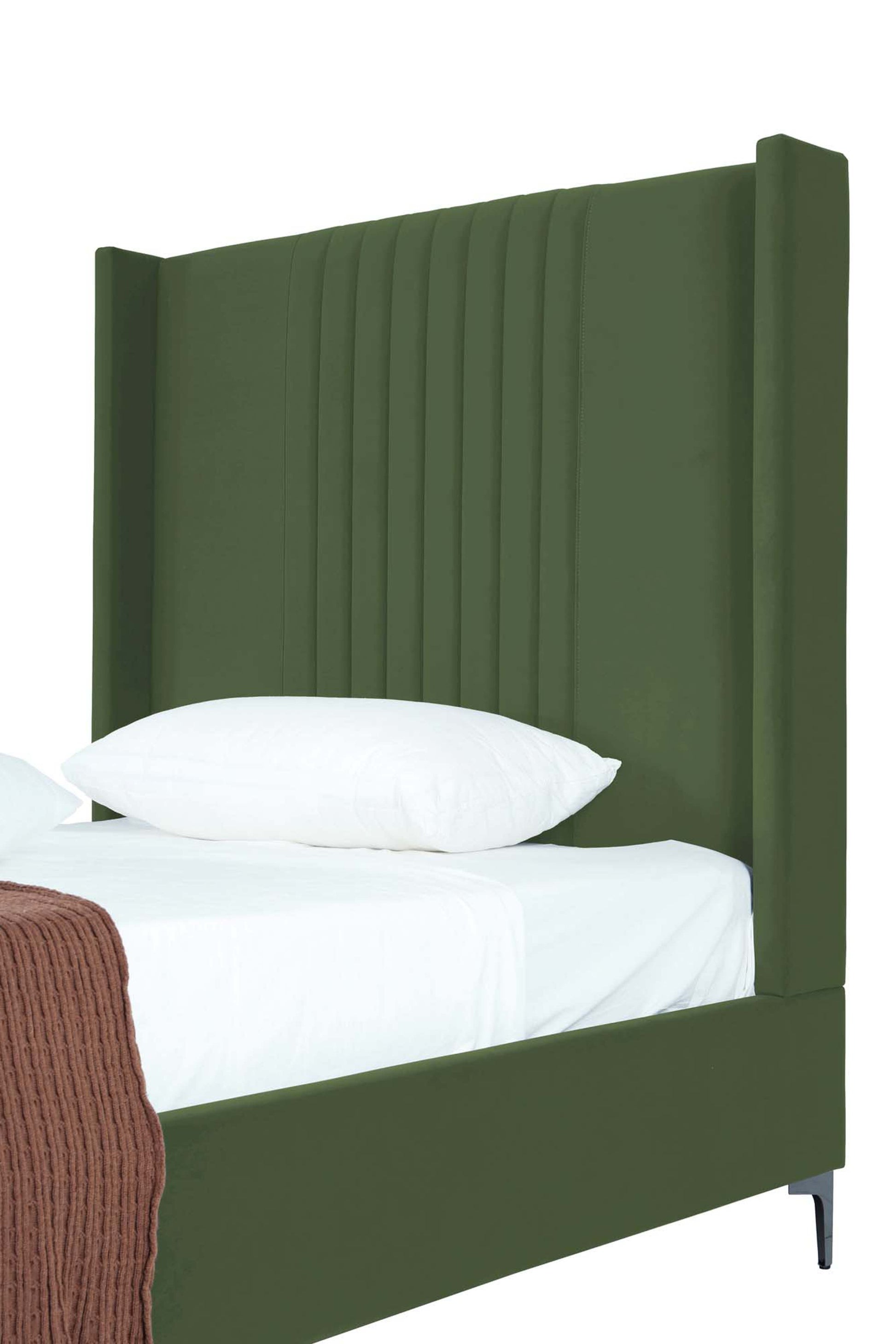 Close-up of Promenade Moss Green 48' Velvet Bed headboard showing vertical channel tufting and plush velvet texture.