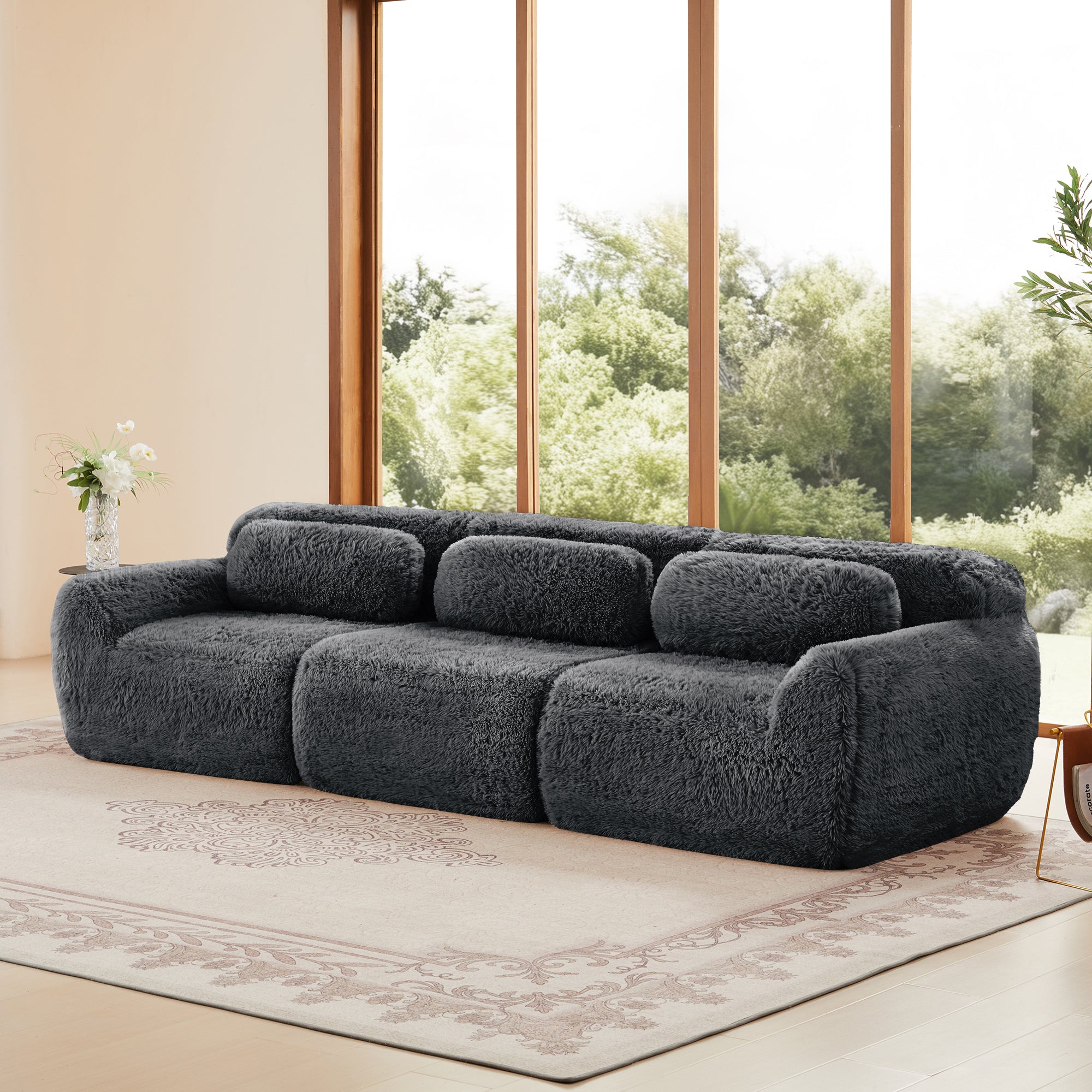 Three-seat Modular Sectional Sofa - Comfortable & Versatile Design with soft plush fabric and wide armrests, placed in a bright, modern room.