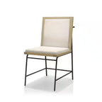 Three-quarter view of Oak Beige Dining Chair with beige fabric seat and back, wood frame, and minimalist black metal base.