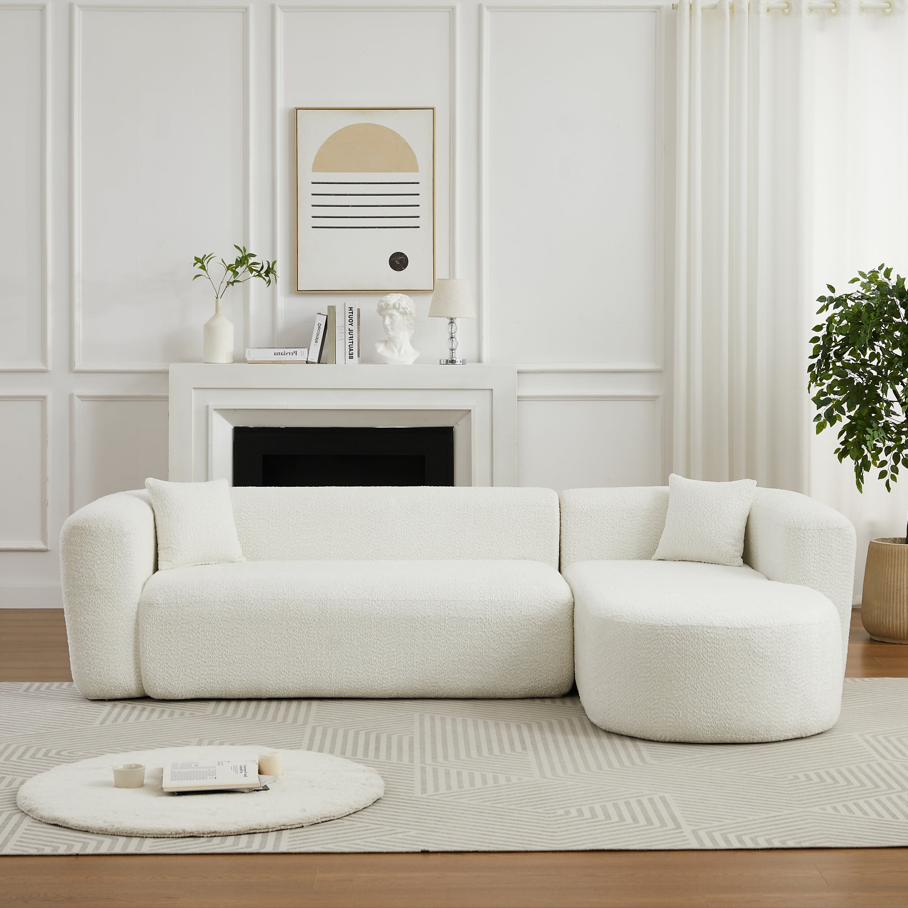 Beige chenille modular sectional sofa with clean lines and plush cushions, styled in a contemporary living room with fireplace backdrop.