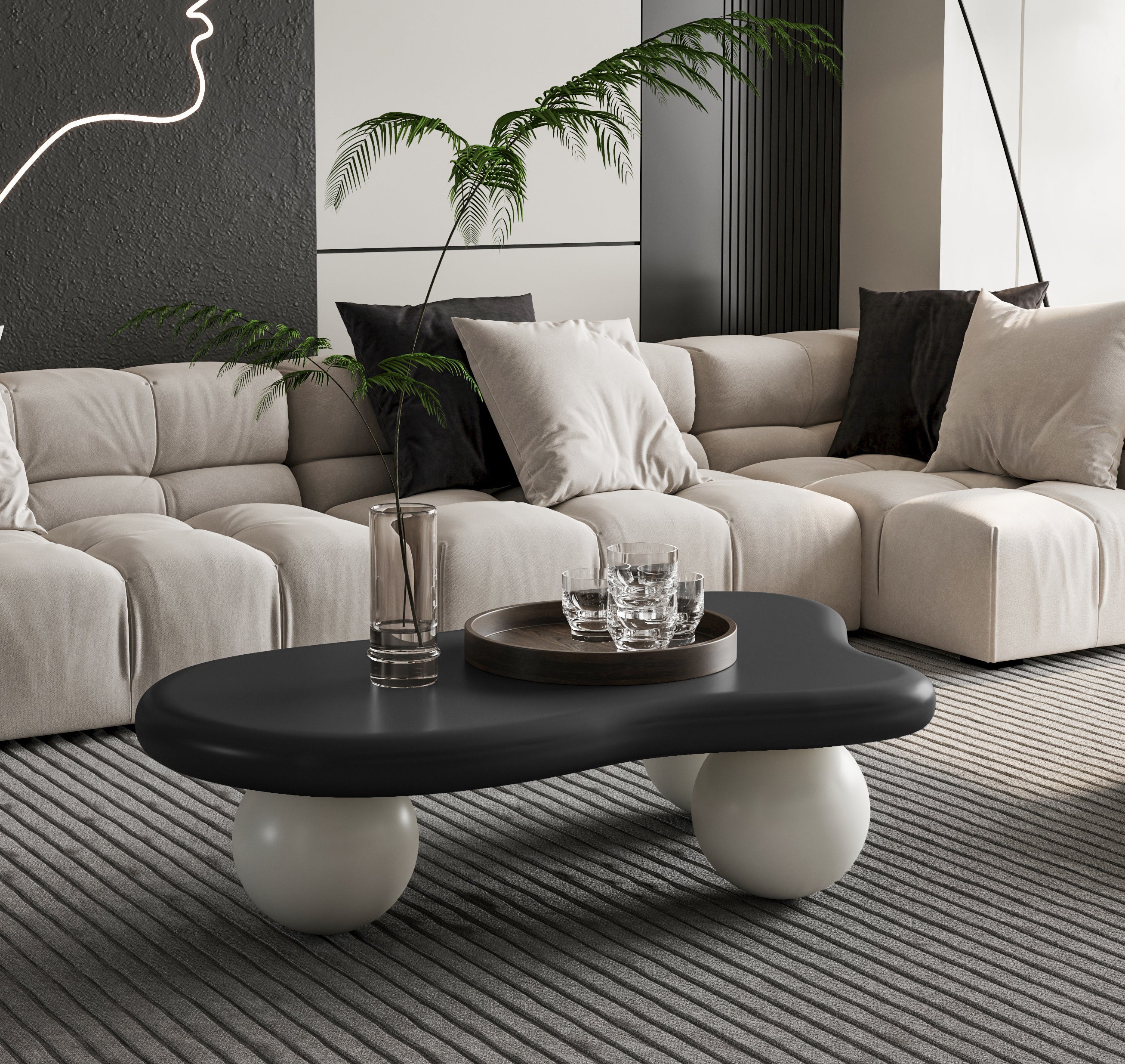 Cloud Shaped Coffee Table - Black Top White Legs styled in a beige living room. Unique design adds elegance to modern home decor.