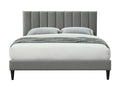 Modern gray upholstered king bed frame with vertical channel-tufted headboard and dark tapered legs.