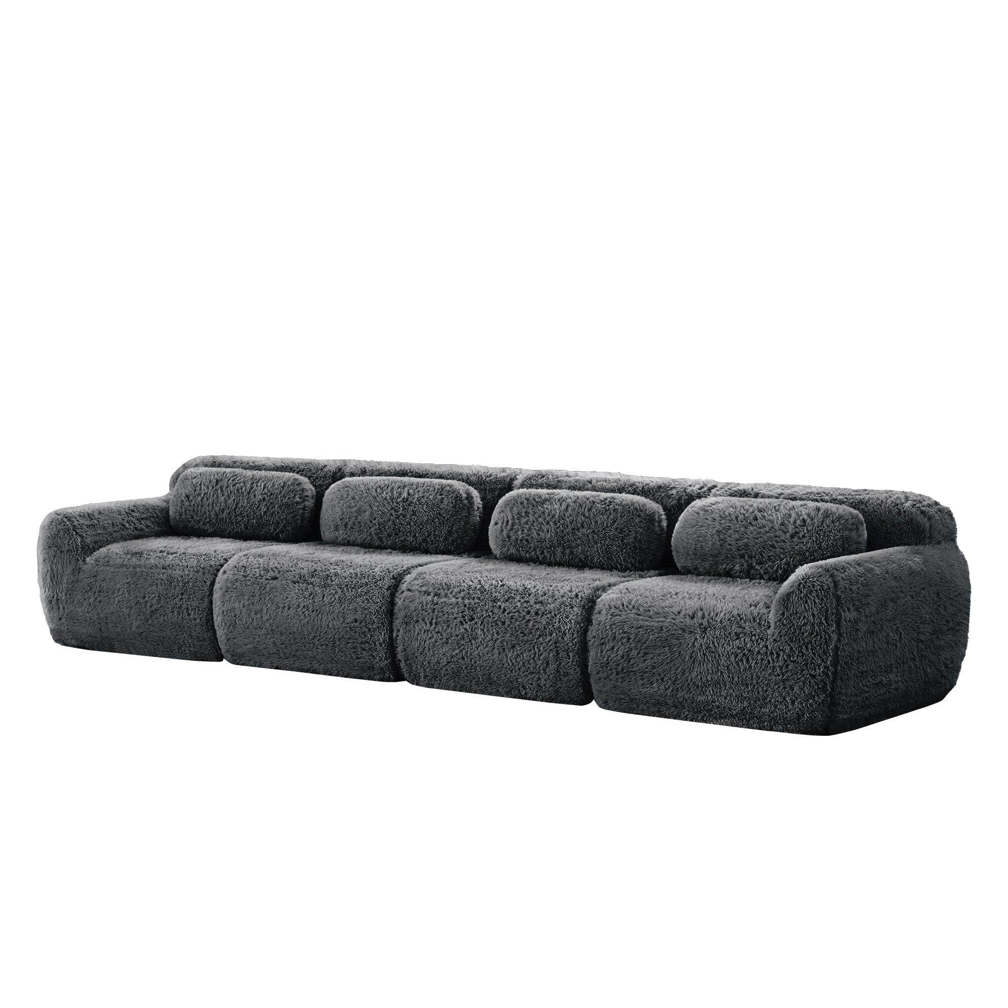 Angled side view of 149'' modular plush sofa in dark grey, showcasing its rounded edges and deep cushioned seats.
