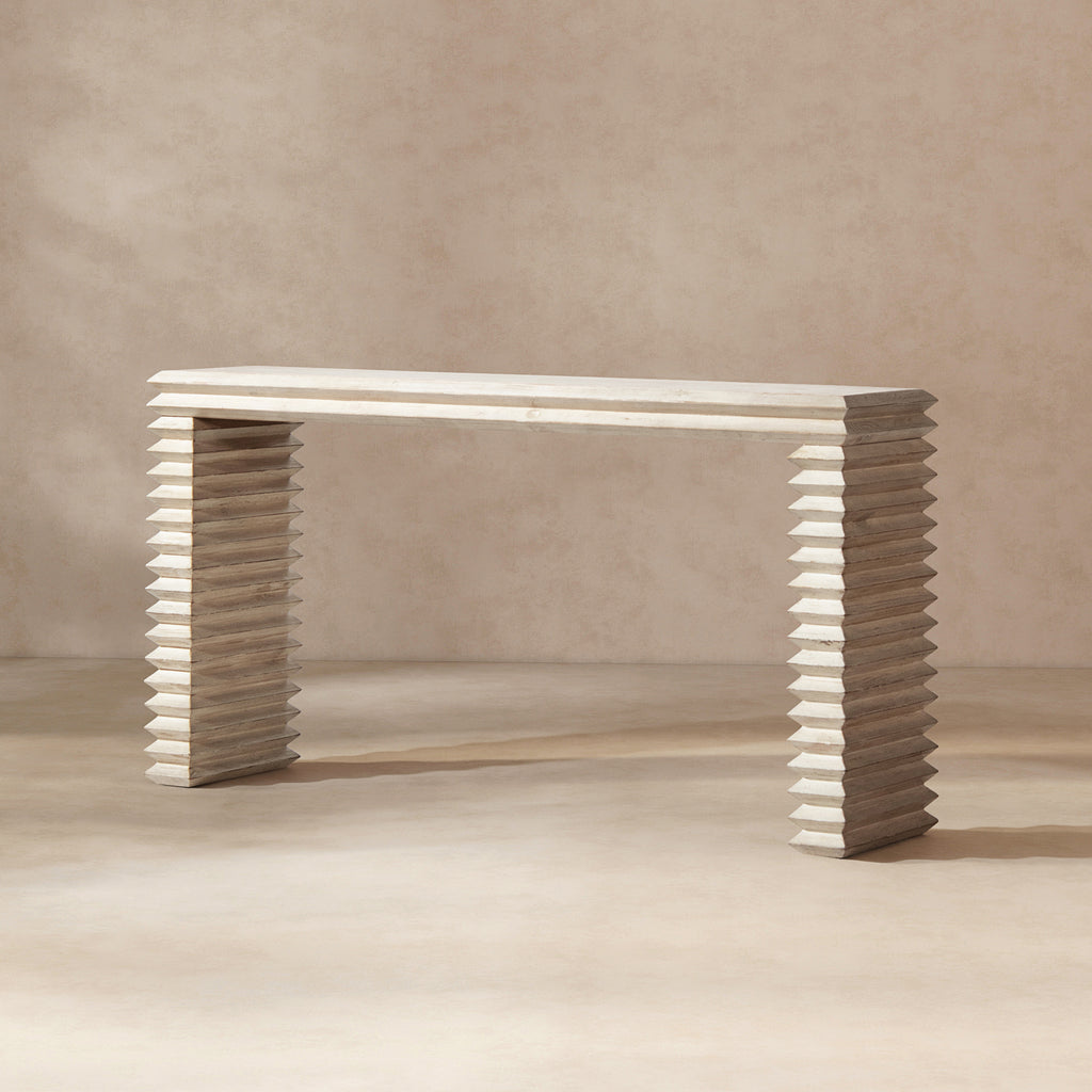 Whitewashed reclaimed pine console table featuring a minimalist geometric waterfall design with stacked, ribbed legs.