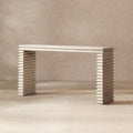 Whitewashed reclaimed pine console table featuring a minimalist geometric waterfall design with stacked, ribbed legs.