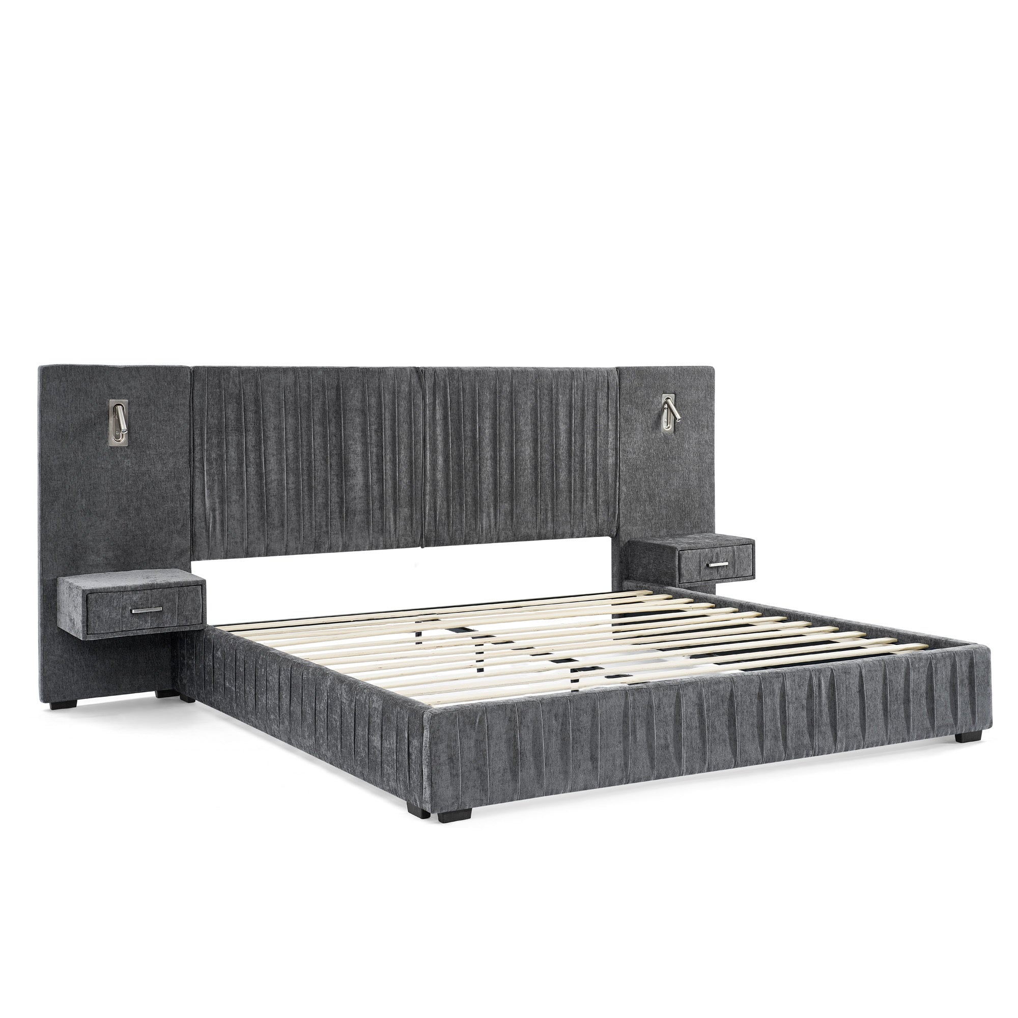 Angled view of queen upholstered bed frame with slats. Features built-in bedside tables, lamps, and pleated headboard on solid frame.