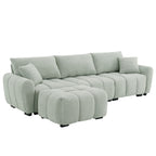 Angled view of modular sectional sofa with ottoman in right-facing setup, featuring thick cushions and boucle fabric finish.