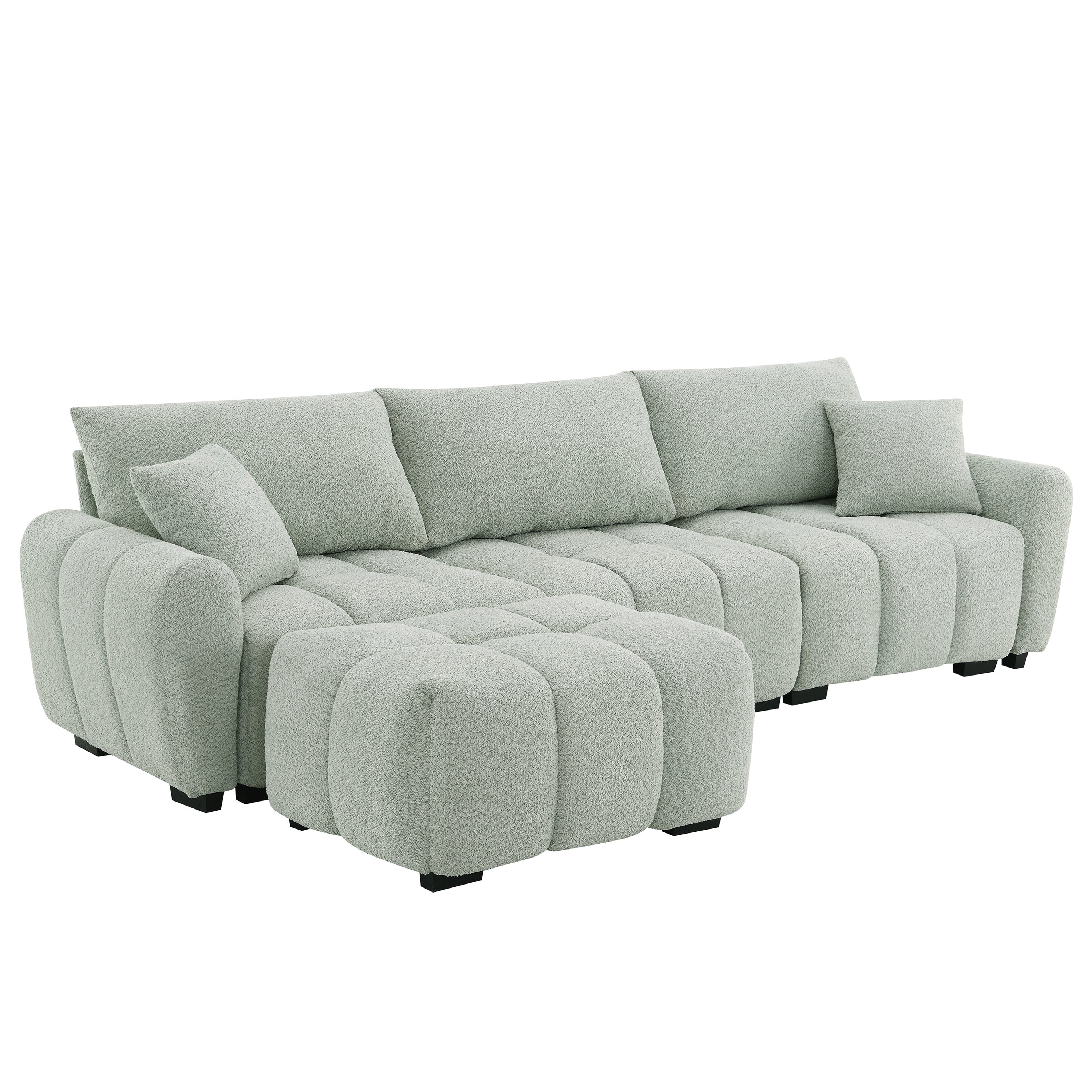 Angled view of modular sectional sofa with ottoman in right-facing setup, featuring thick cushions and boucle fabric finish.