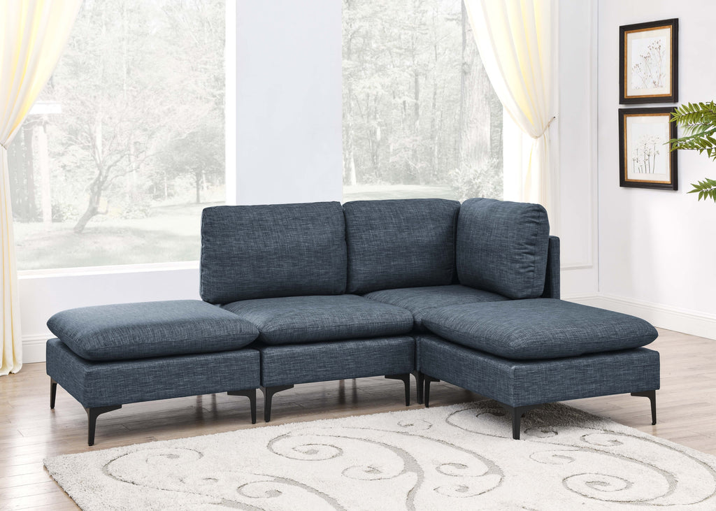 Modern navy blue linen modular sectional sofa featuring plush cushions and sleek black metal legs in a bright living room.