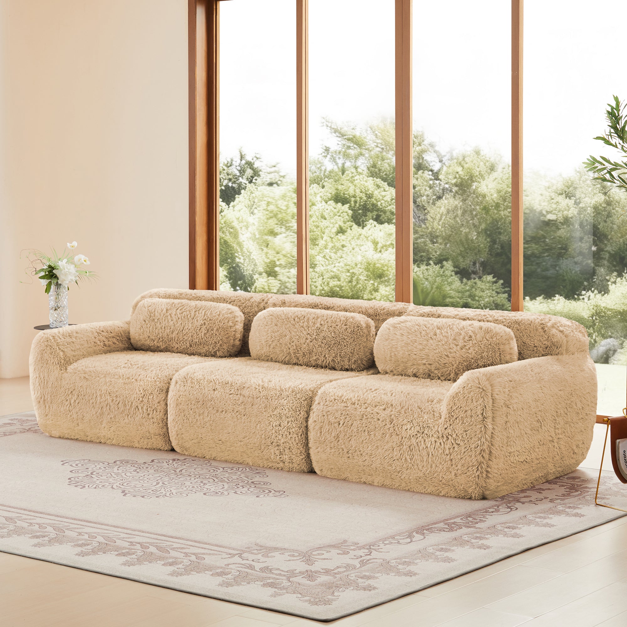 Sectional modular sofa with plush beige fabric and ergonomic cushions, ideal for spacious living rooms with natural lighting.