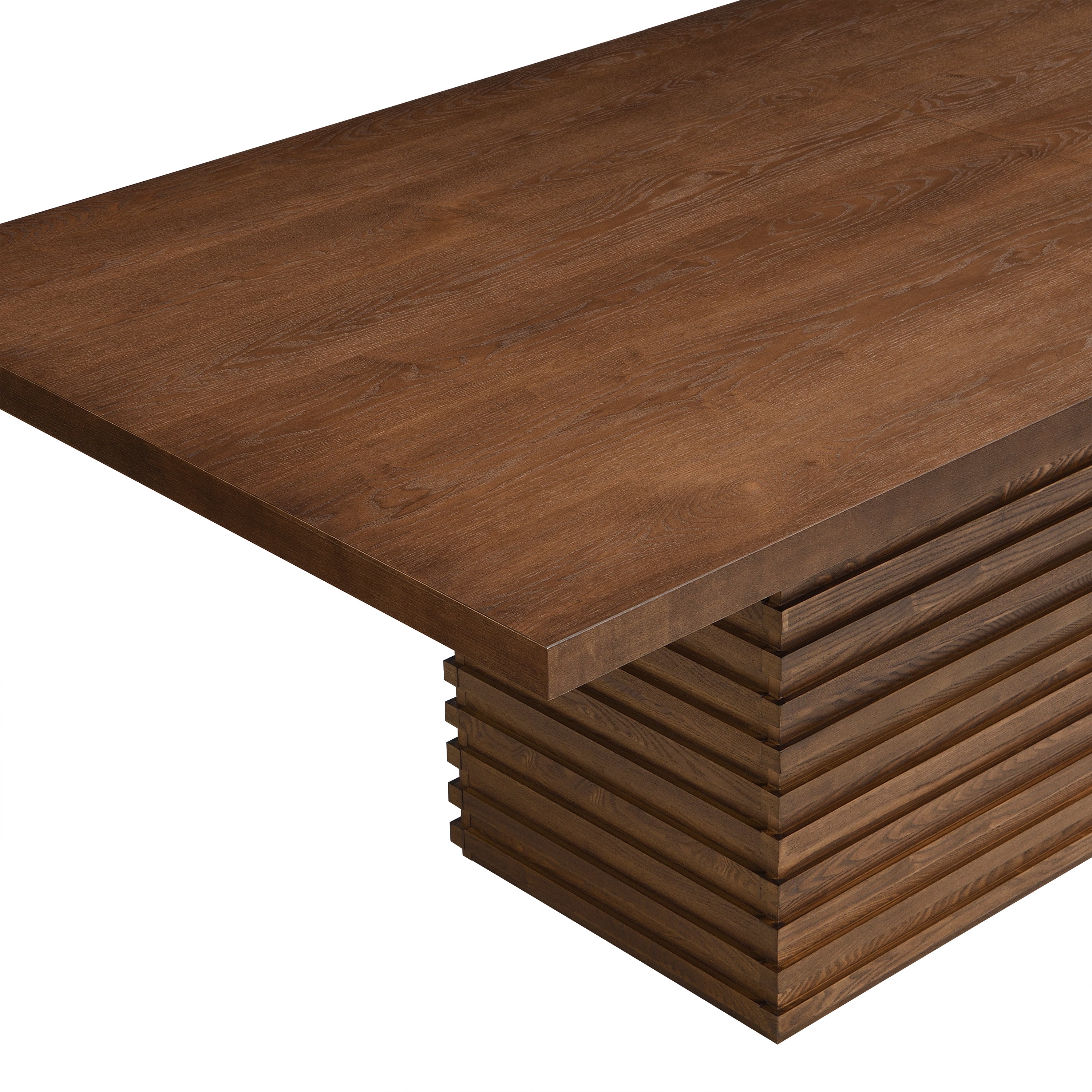 Close-up of Coad 84-inch Walnut Dining Table corner showing thick walnut tabletop and detailed wood grain texture.
