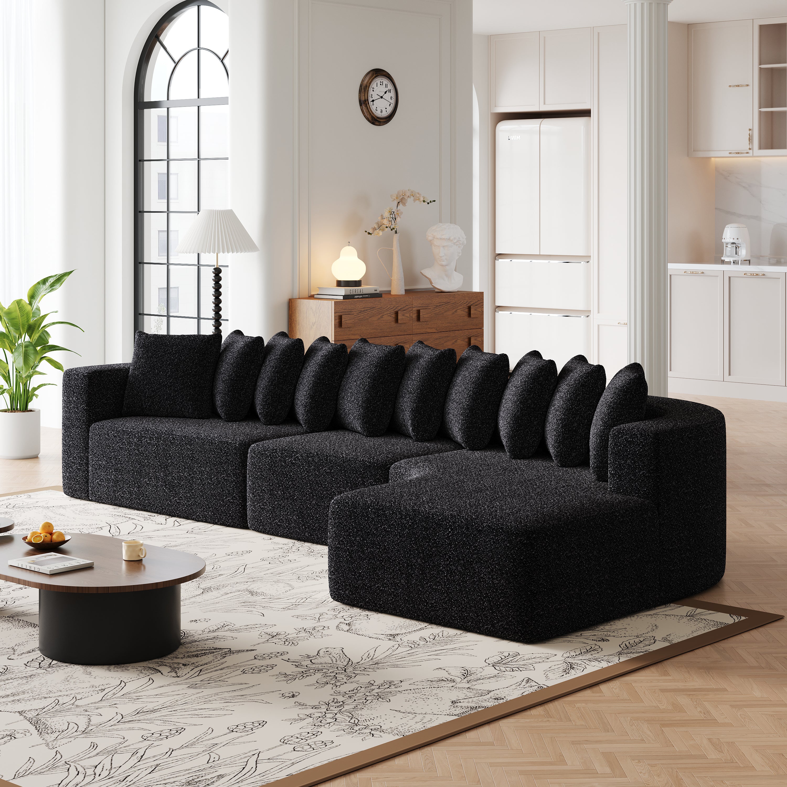 Chenille Sectional Sofa - Modular L-Shaped Sofa in black chenille with 10 pillows, styled in a modern space with white columns and natural light.