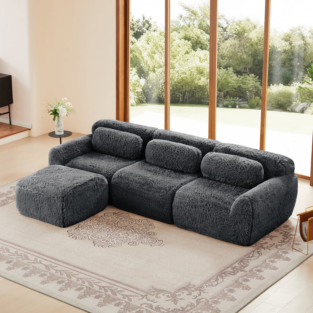 Dark Grey Plush Sofa - L-Shaped, No Assembly | Modular Design with ottoman, set in a bright living room with large windows and neutral decor.