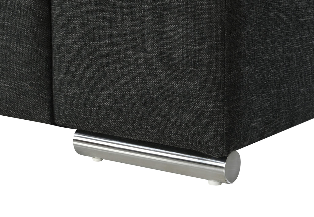 Detail of Gianna Black Linen Arm Chair chrome leg, showcasing sturdy cylindrical metal base for modern elegance and durability.