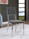 Minimalist style dining chair with chrome legs, acrylic backrest, and gray cushioned seat in a modern room setting.