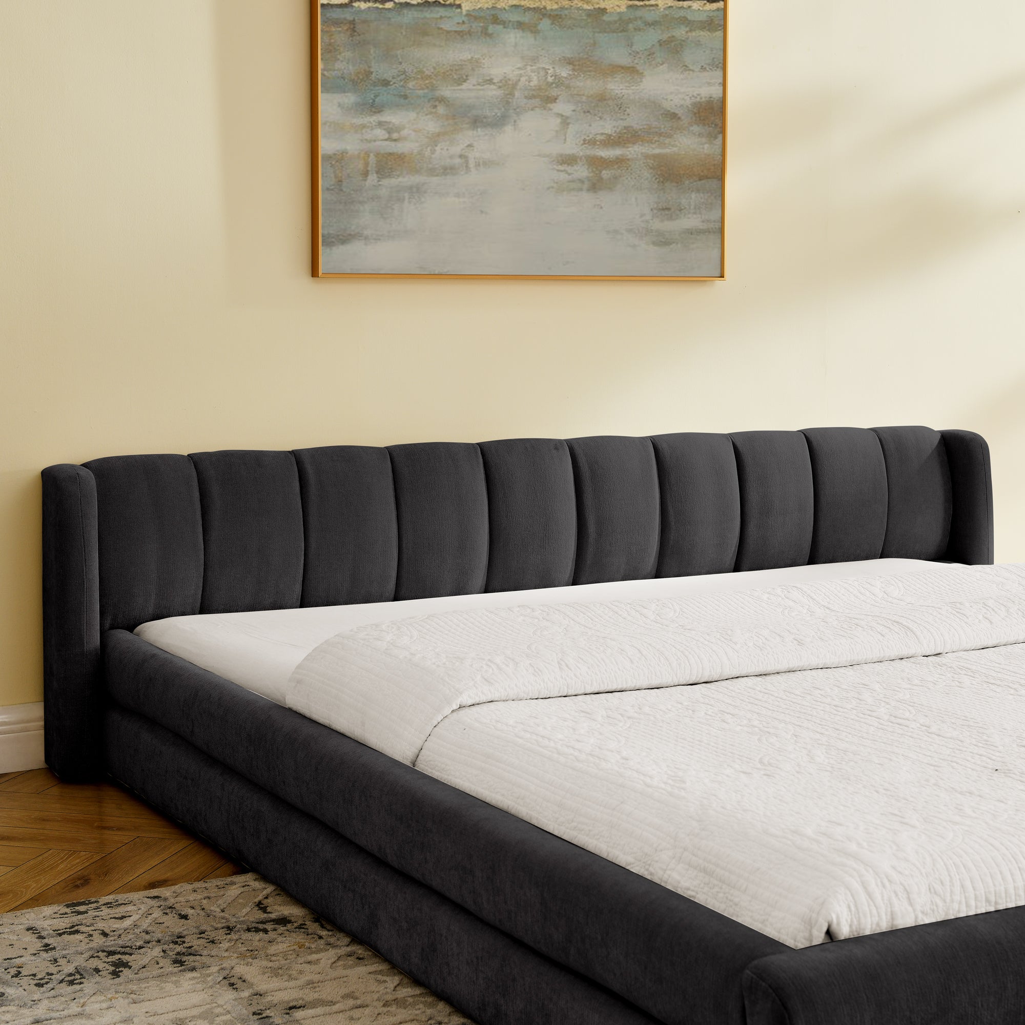 Side angle of the King Size Bed Frame - Chenille Upholstered in dark gray, featuring a low-profile frame and plush headboard.