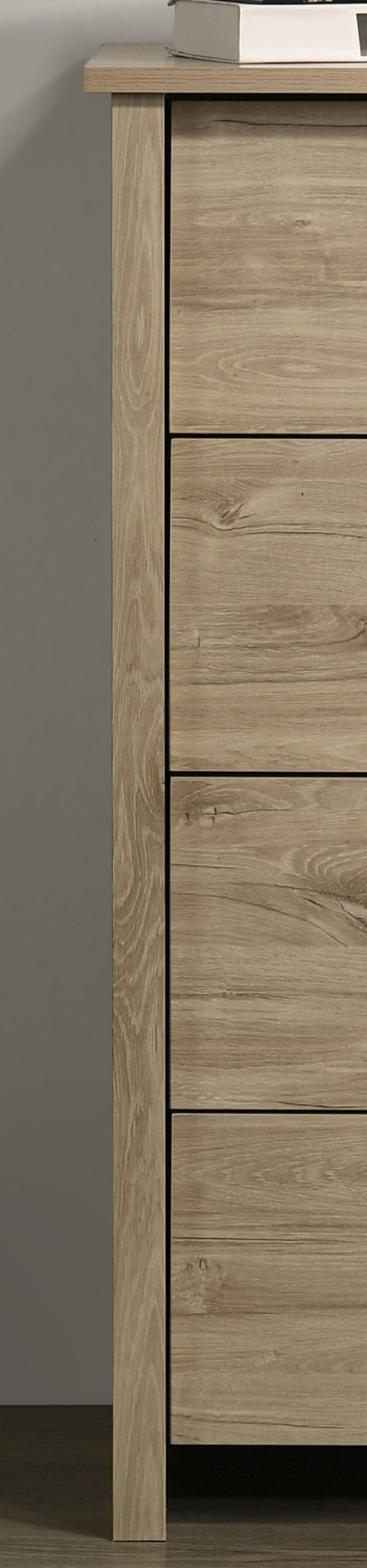 Side view of Light Oak 4-Drawer Chest highlighting durable frame and natural wood finish for long-lasting use.