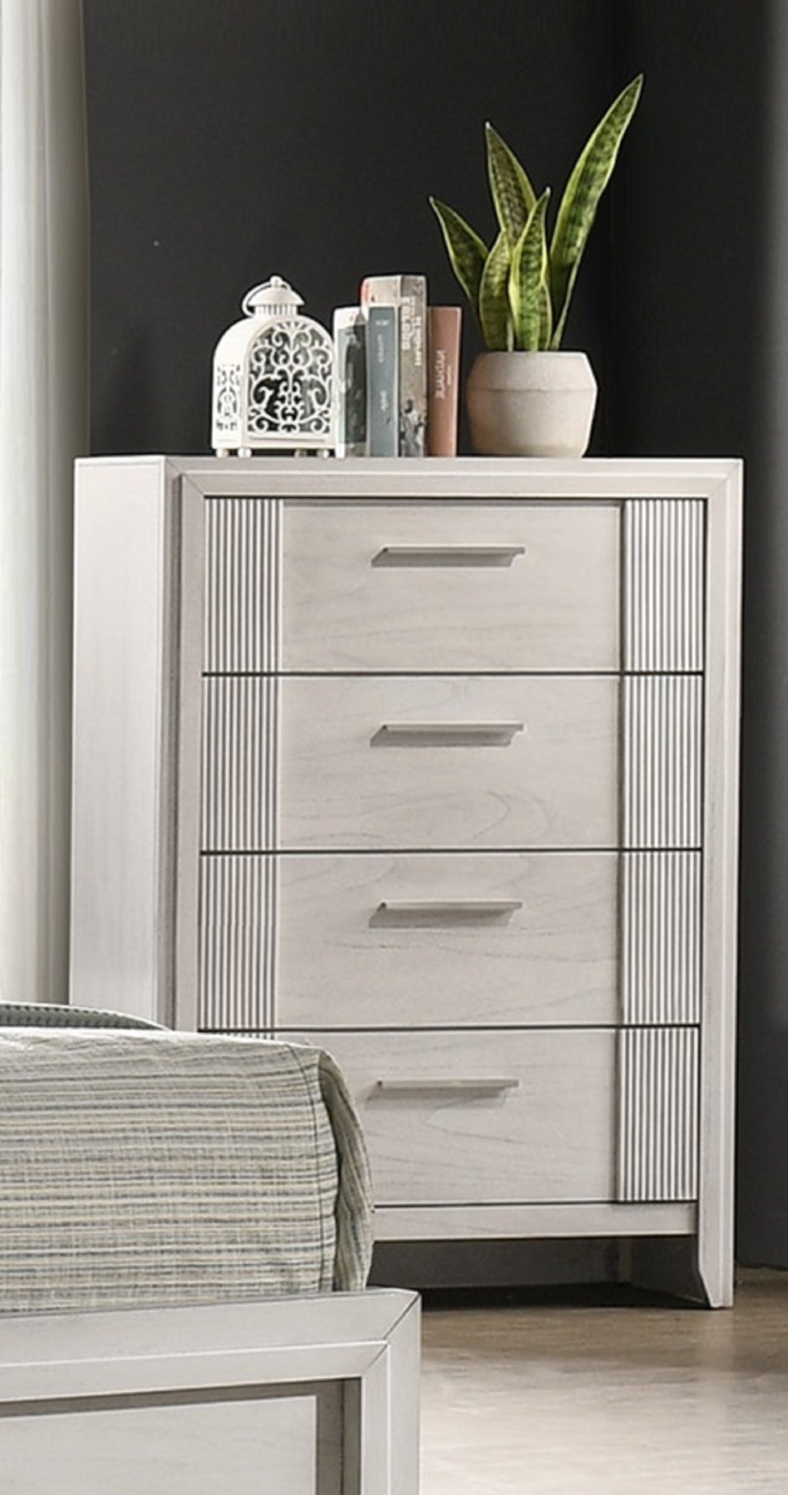 Contemporary 4-Drawer Chest - Tall Storage placed in a bedroom corner, styled with books and decor for a modern aesthetic.