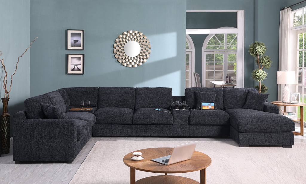 Full view of Celine sectional sofa in dark gray with chaise, cupholders, and USB ports. Ideal for contemporary living spaces.
