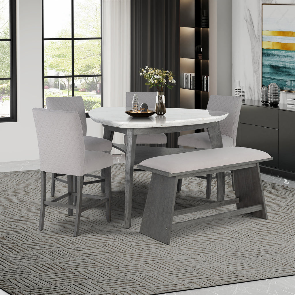 Jasmine Bar Table set in a dining room with grey chairs and bench, featuring a grey marble top and arched legs, seats 4 comfortably.