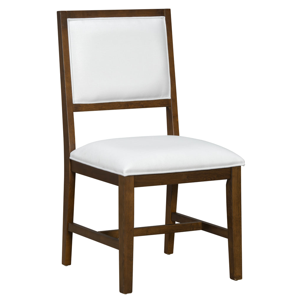 Farmhouse dining chair with white upholstered seat and backrest, featuring a warm wood frame. Ideal for rustic dining room settings.