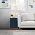 Nora 15 Inch Chairside Table in Blue Denim with poplar wood base beside white sofa. No assembly required, ideal for modern living rooms.