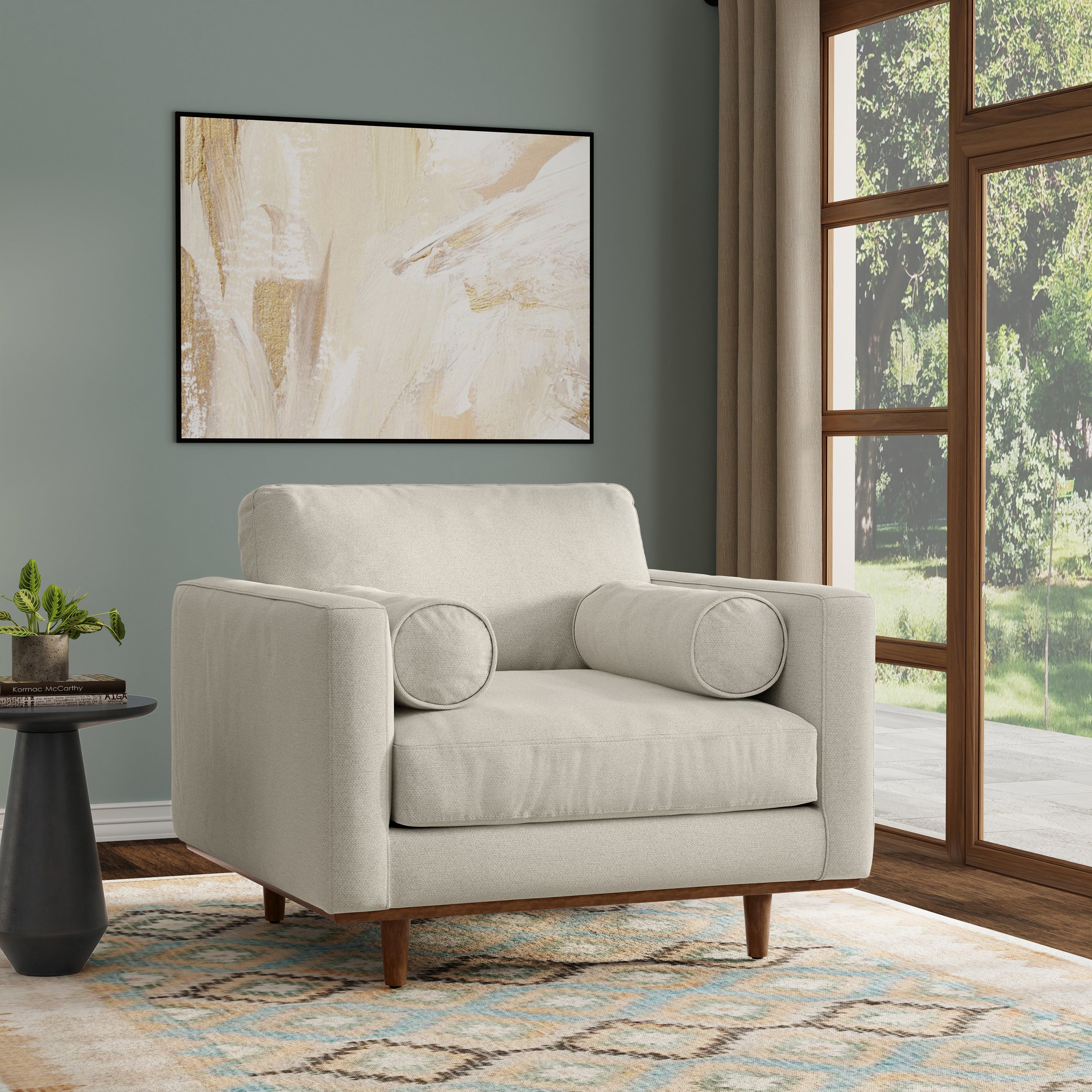 Modern armchair cream white from Morrison Collection in a living room setting with wood legs and bolster pillows. Stylish and cozy for any space.