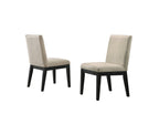 Pair of upholstered chairs from Jasper Dining Set - Black Round Table & Chairs. Beige fabric with black wooden legs.
