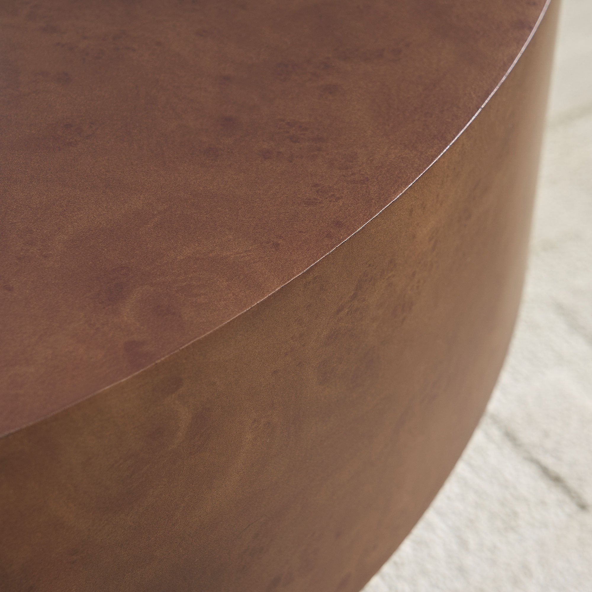 Edge detail of Faux Burl Coffee Table showing seamless round design and rich burl wood texture in walnut tone.