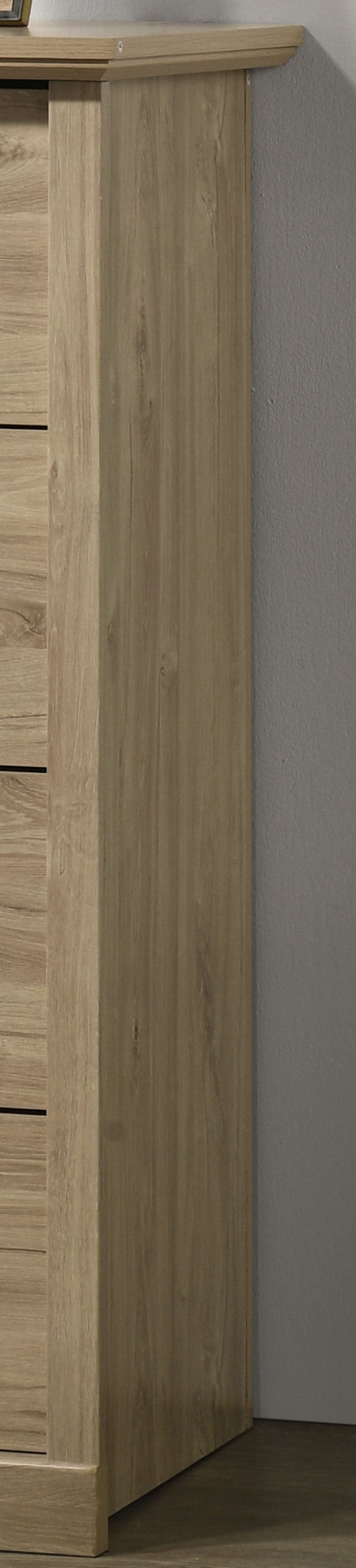 Side panel of Elara Oak 4-Drawer Chest - Sleek Storage Solution showing light oak wood grain and sturdy construction.