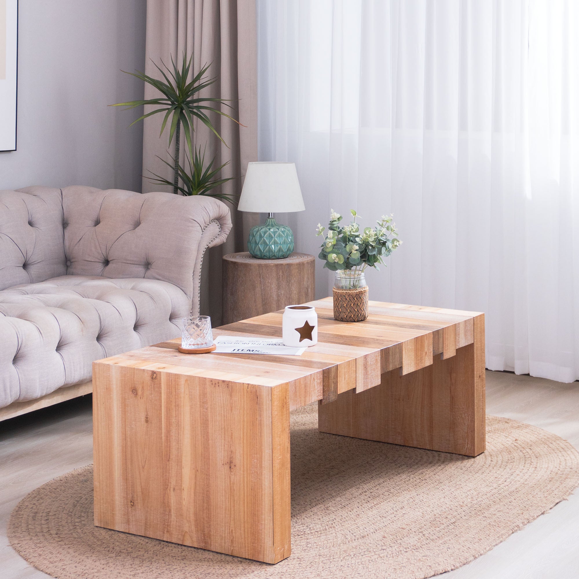 Modern Rustic Coffee Table placed on a woven rug, complementing a neutral-toned living room with its natural wood texture.
