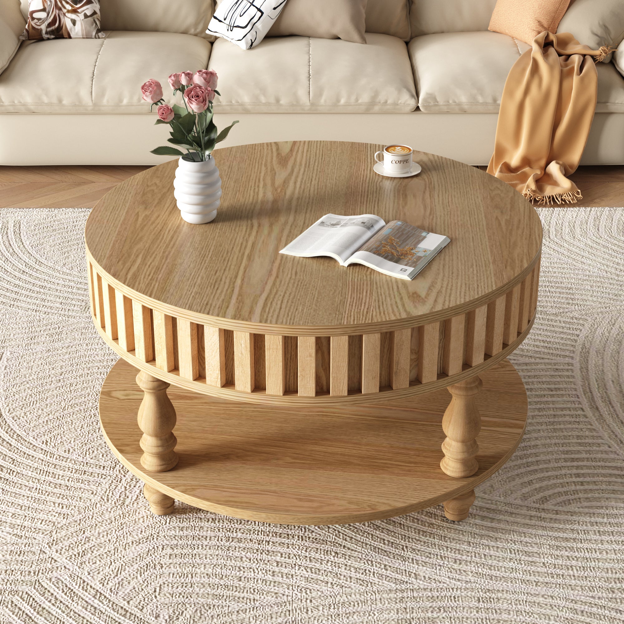 Round mid-century modern coffee table in natural wood finish with fluted sides and closed top, styled with a vase and book.