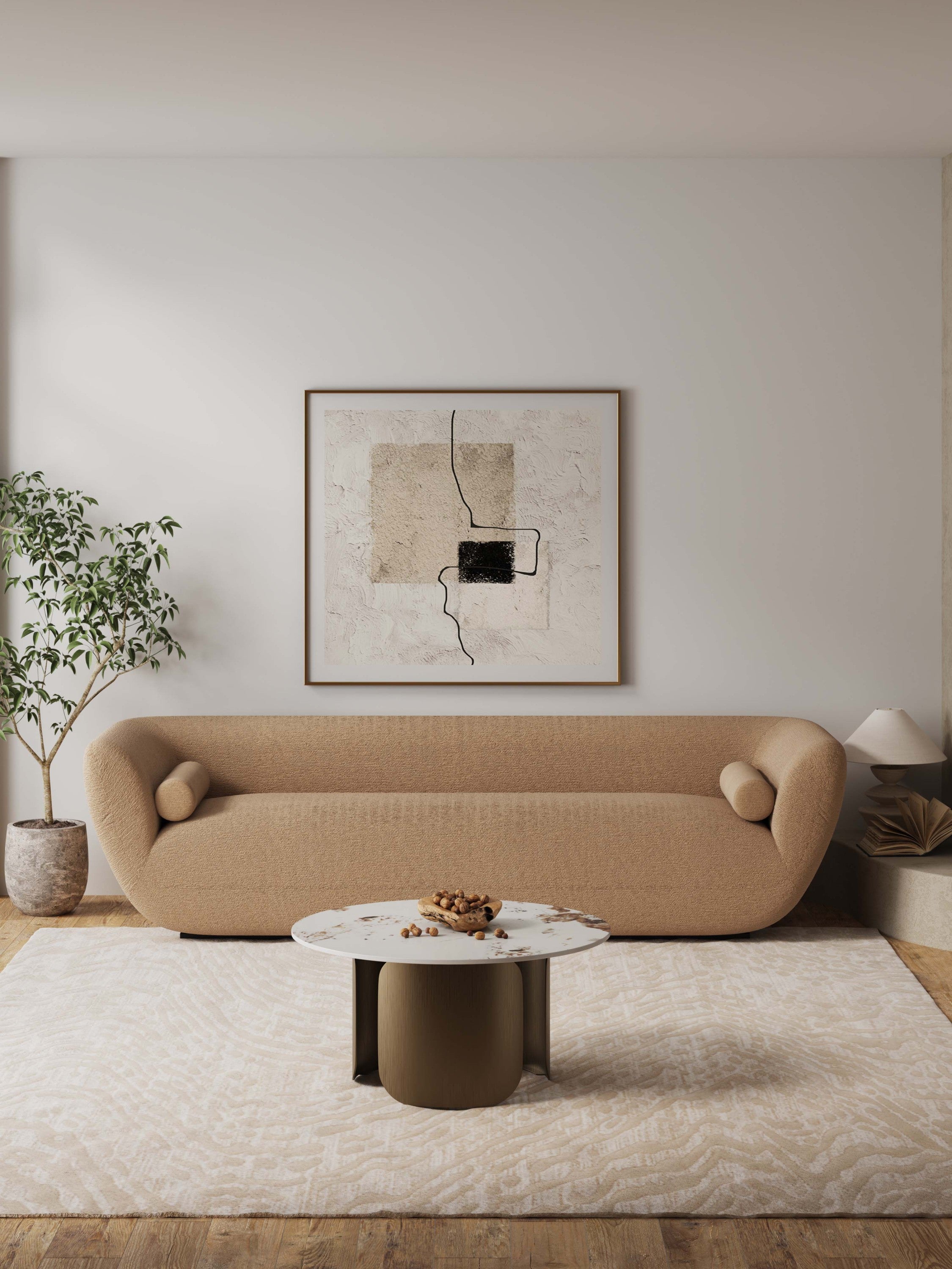 Modern Stone Coffee Table in Bronze placed in a minimalist living room, enhancing decor with its sleek round design and neutral tones.