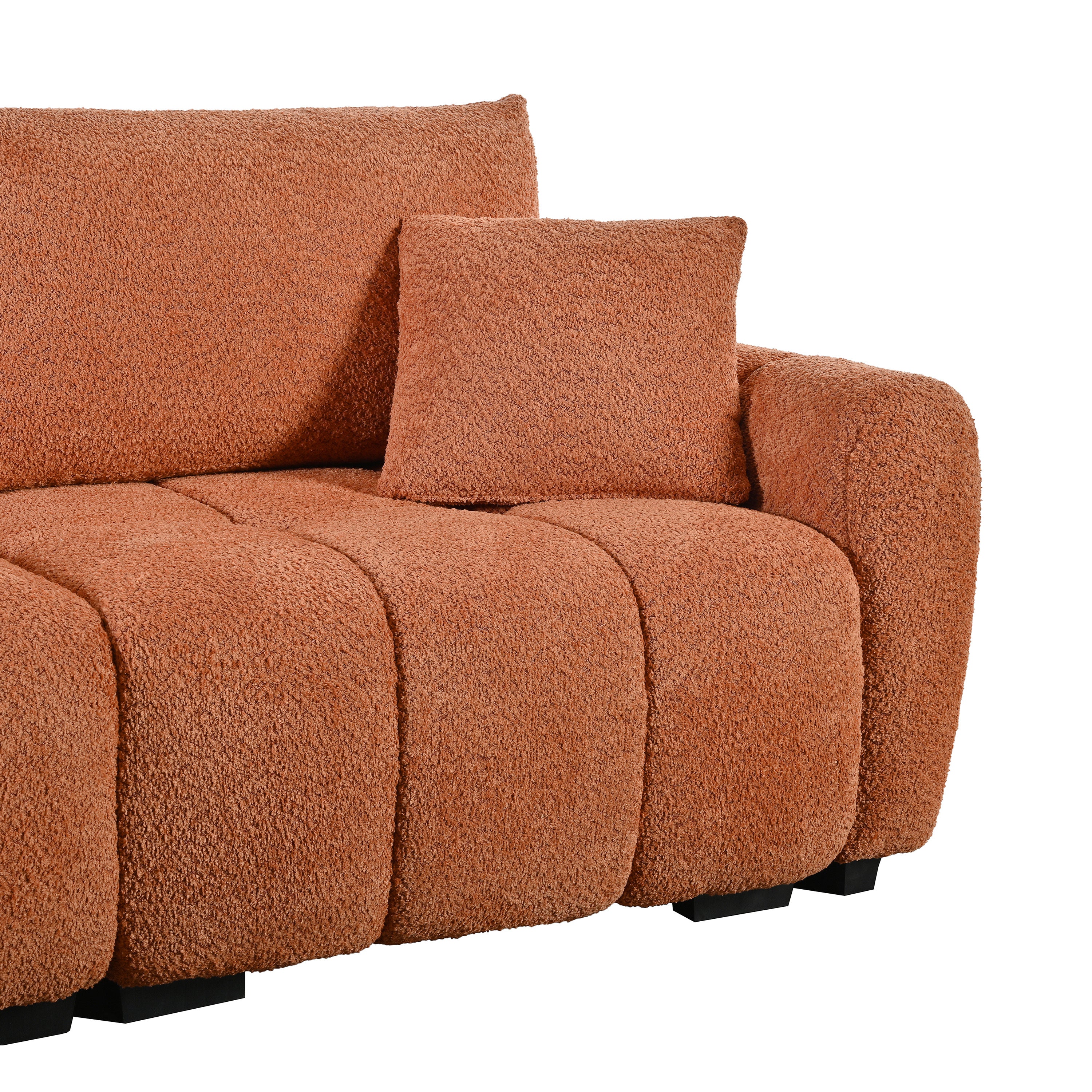 Armrest and cushion detail of modular sectional sofa with ottoman in boucle fabric, showing soft texture and supportive design.