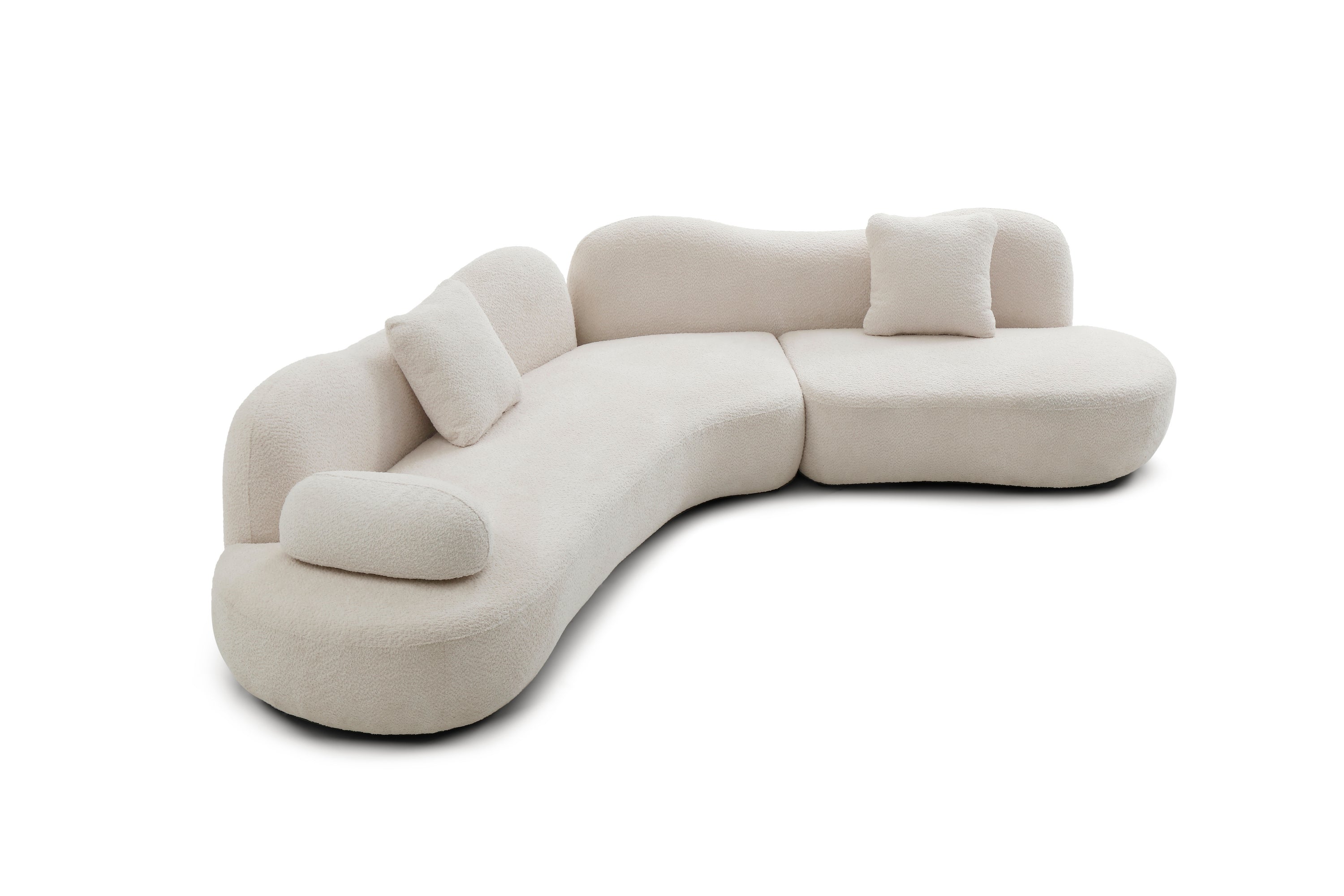 Curved sectional sofa in soft white boucle with solid wood frame, featuring three cushions and a sculpted silhouette for modern interiors.