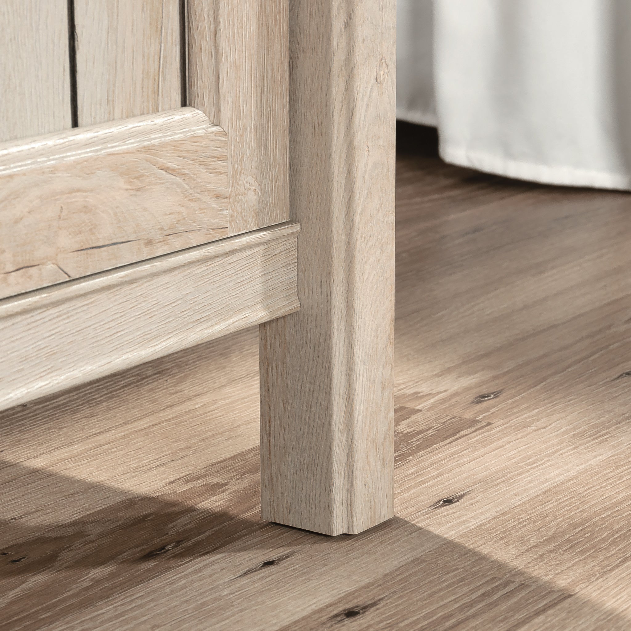 Detail of leg design on Gray Night Stand with Drawer, highlighting sturdy engineered wood construction and coastal finish.