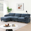 Modular sofa with charger in blue fabric featuring wide seating, USB ports, and phone holder, ideal for modern living room comfort.