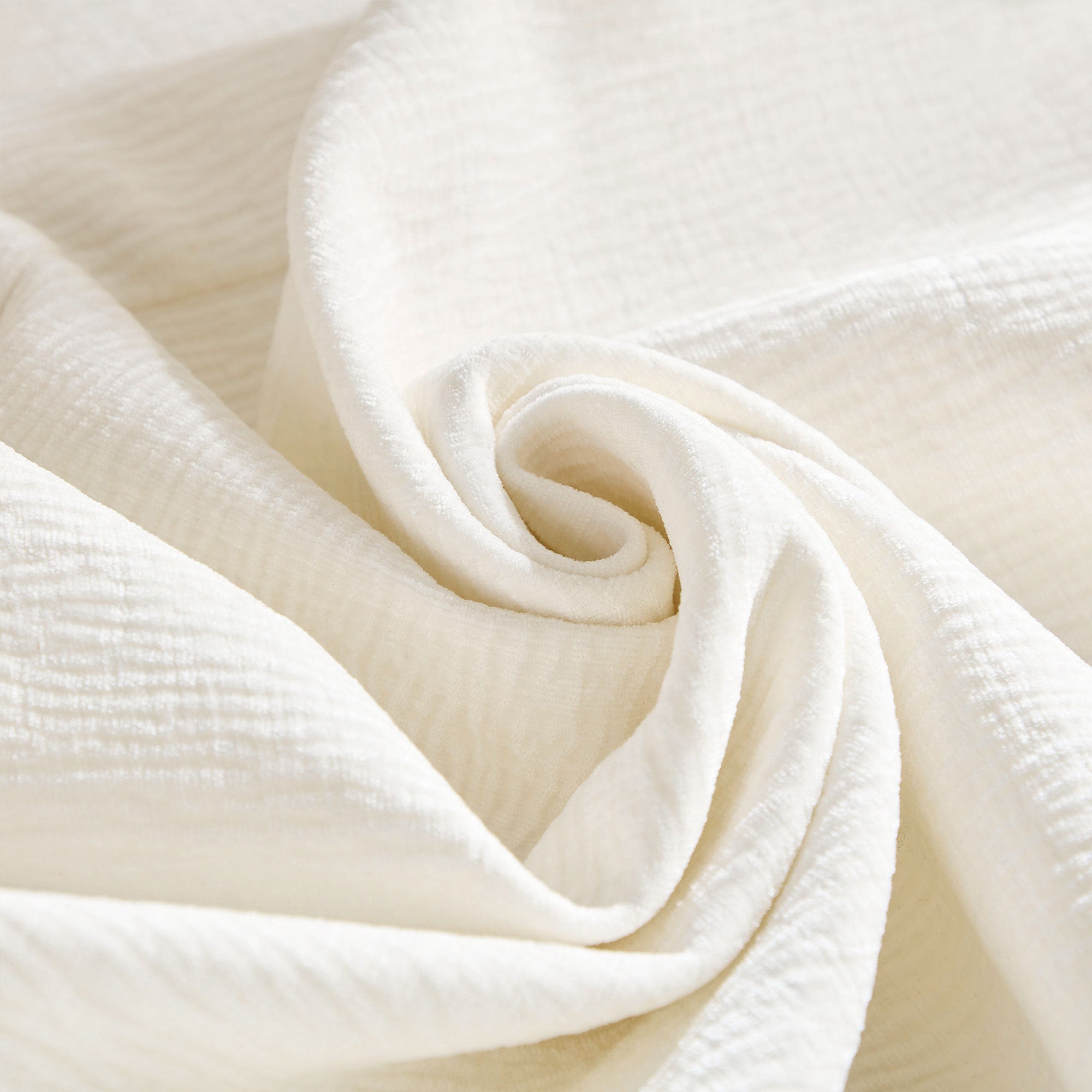 Close-up of beige textured fabric used on the oversized L-shape sectional sofa, showing soft and durable upholstery material.