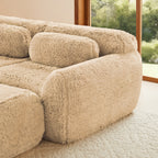 Close-up of armrest and cushion of the 2-seater modular sofa. Plush fabric and ergonomic design for maximum comfort.