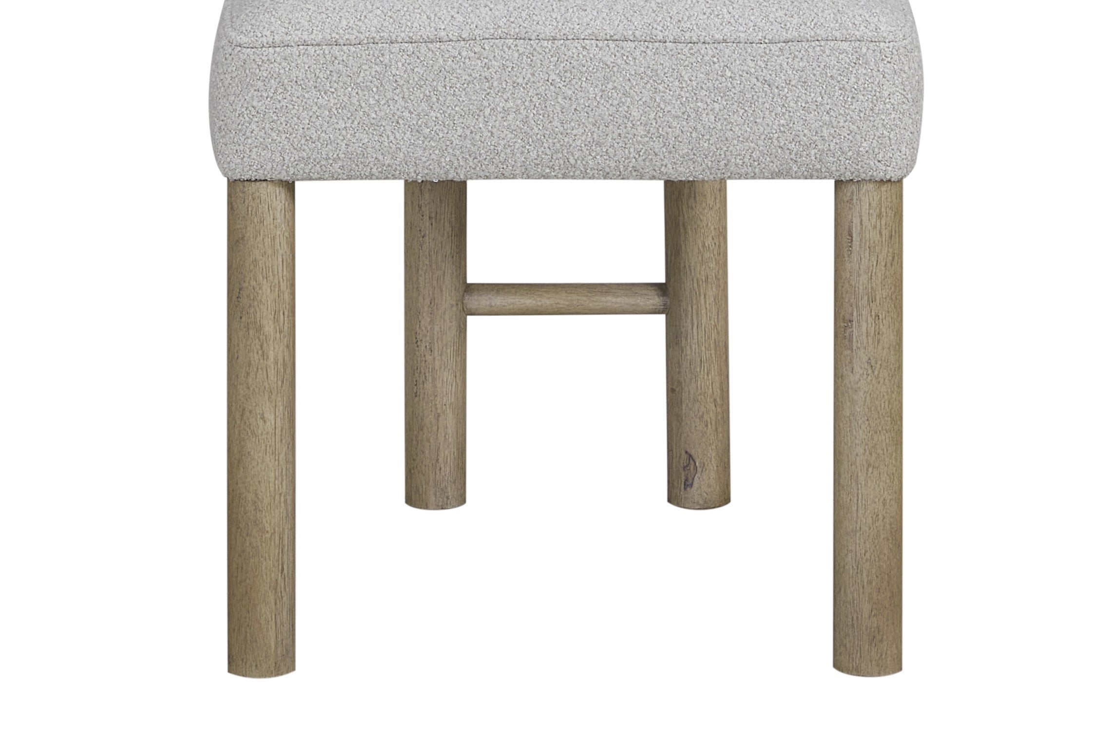 Close-up of oak wood legs and support bar of upholstered dining chair, showcasing sturdy construction and natural finish.